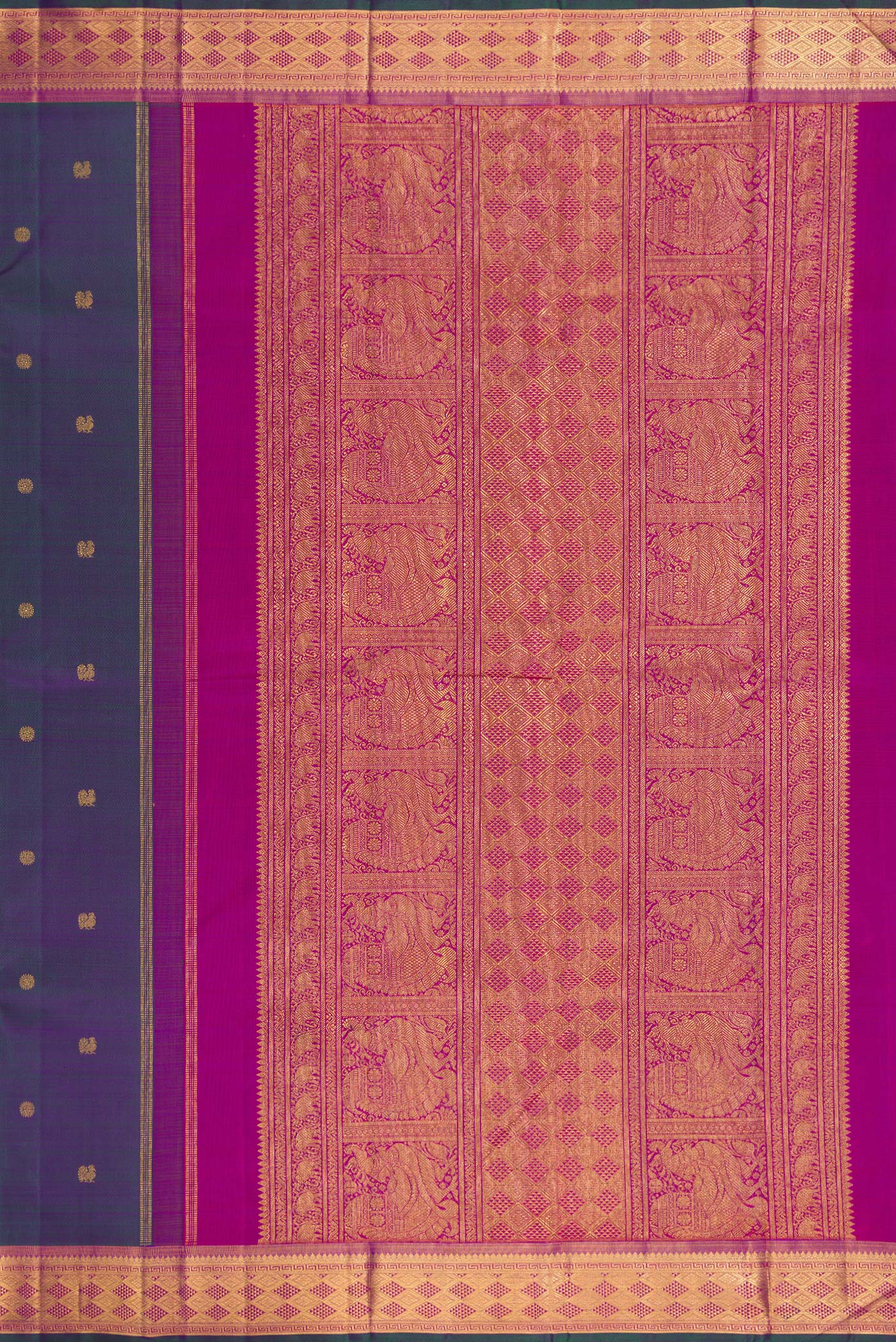 Close up image of the pallu of Peacock Blue Dual Tone Kanchipuram Silk Saree with Zari Butta on the body and Zari Border. 