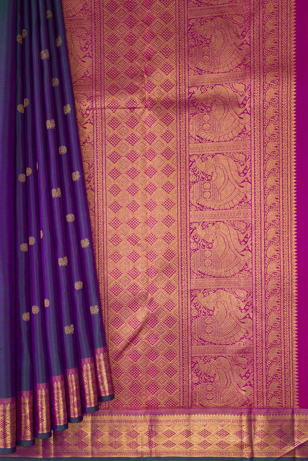 Pleats and pallu of Peacock Blue Dual Tone Kanchipuram Silk Saree with Zari Butta on the body and Zari Border. 