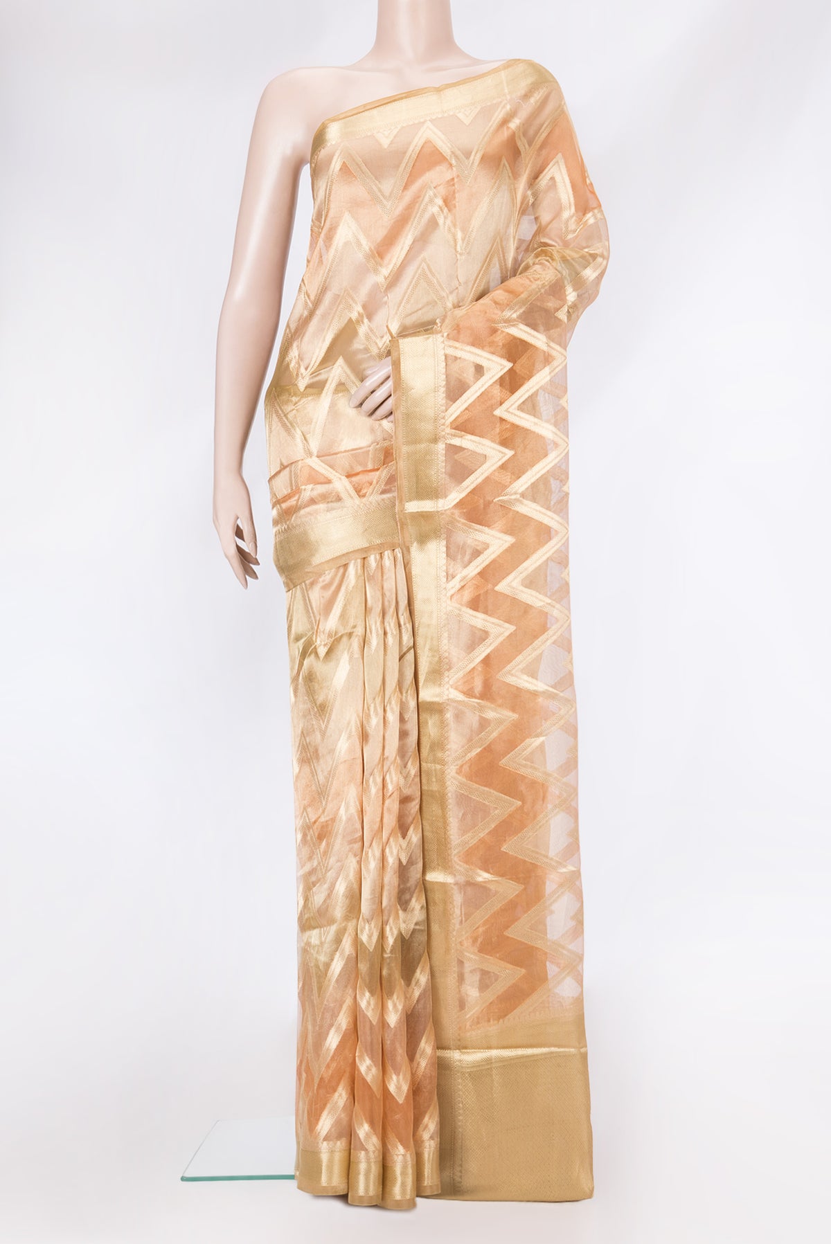 Golden Peach Dual Tone Organza Silk Saree with Zari Brocade on the body and Zari Border.  displayed on a mannequin