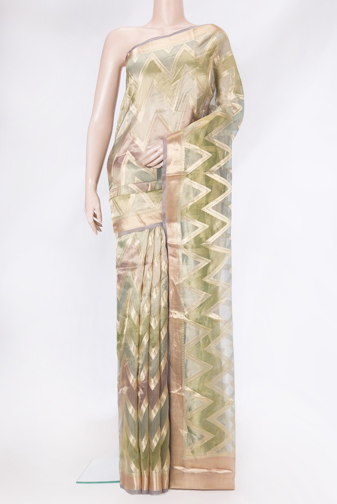 Green Dual Tone Organza Silk Saree with Zari Brocade on the body and Zari Border.  displayed on a mannequin