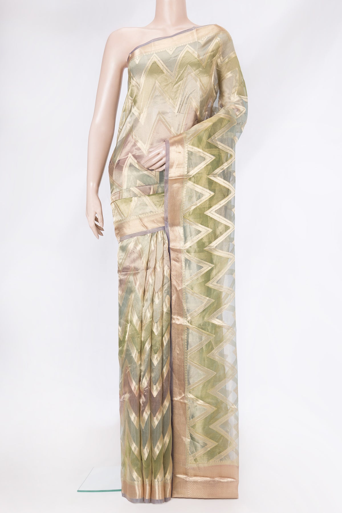 Green Dual Tone Organza Silk Saree with Zari Brocade on the body and Zari Border.  displayed on a mannequin