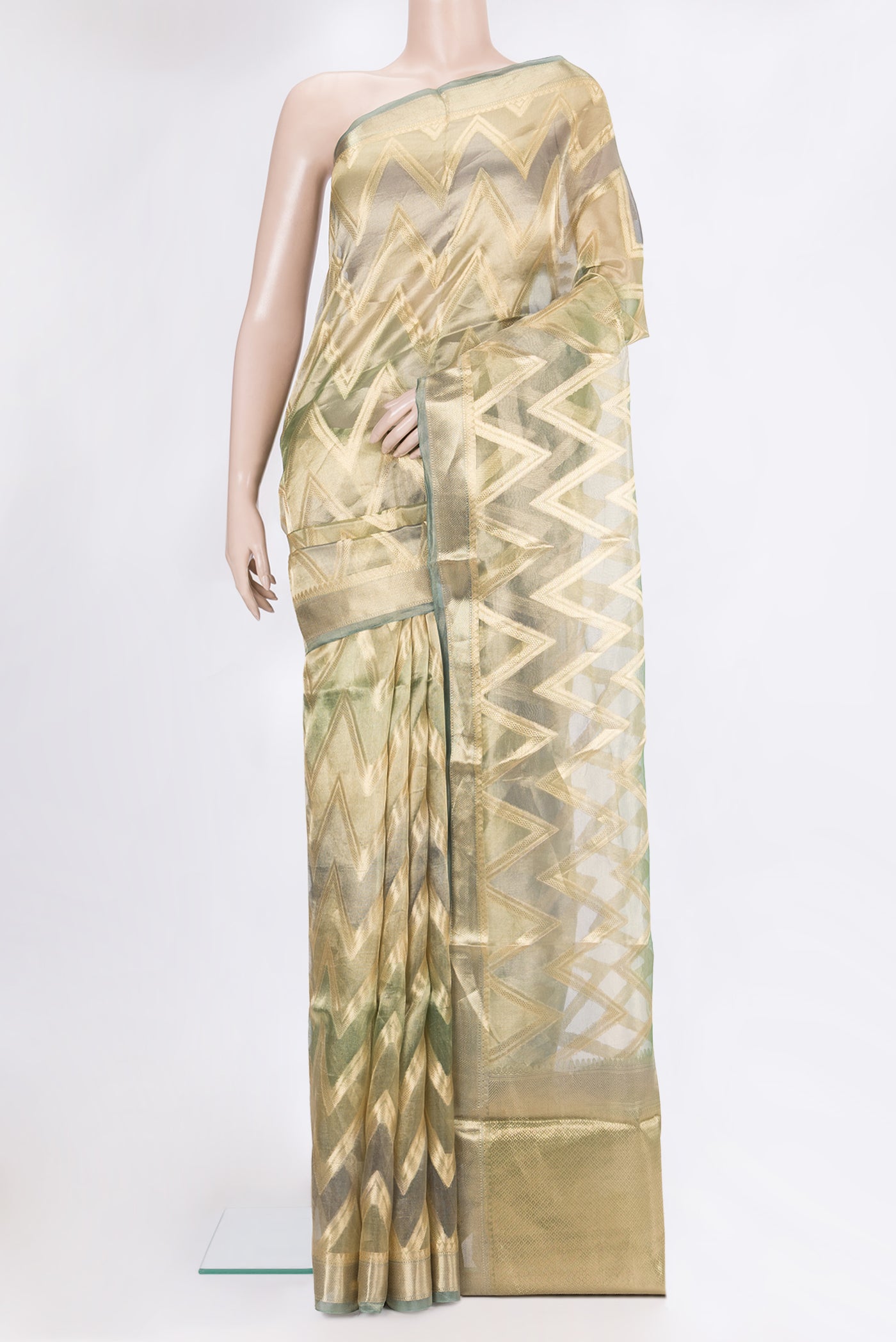 Green Dual Tone Organza Silk Saree with Zari Brocade on the body and Zari Border.  displayed on a mannequin