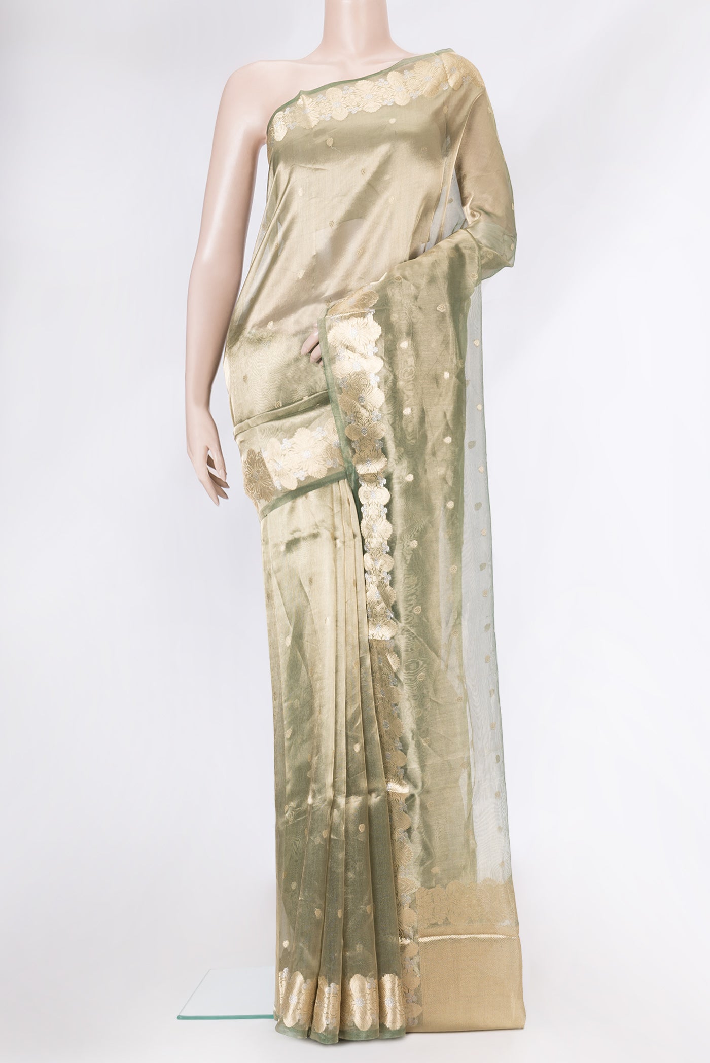 Green Dual Tone Organza Silk Saree with Zari Butta on the body and Zari Border.  displayed on a mannequin