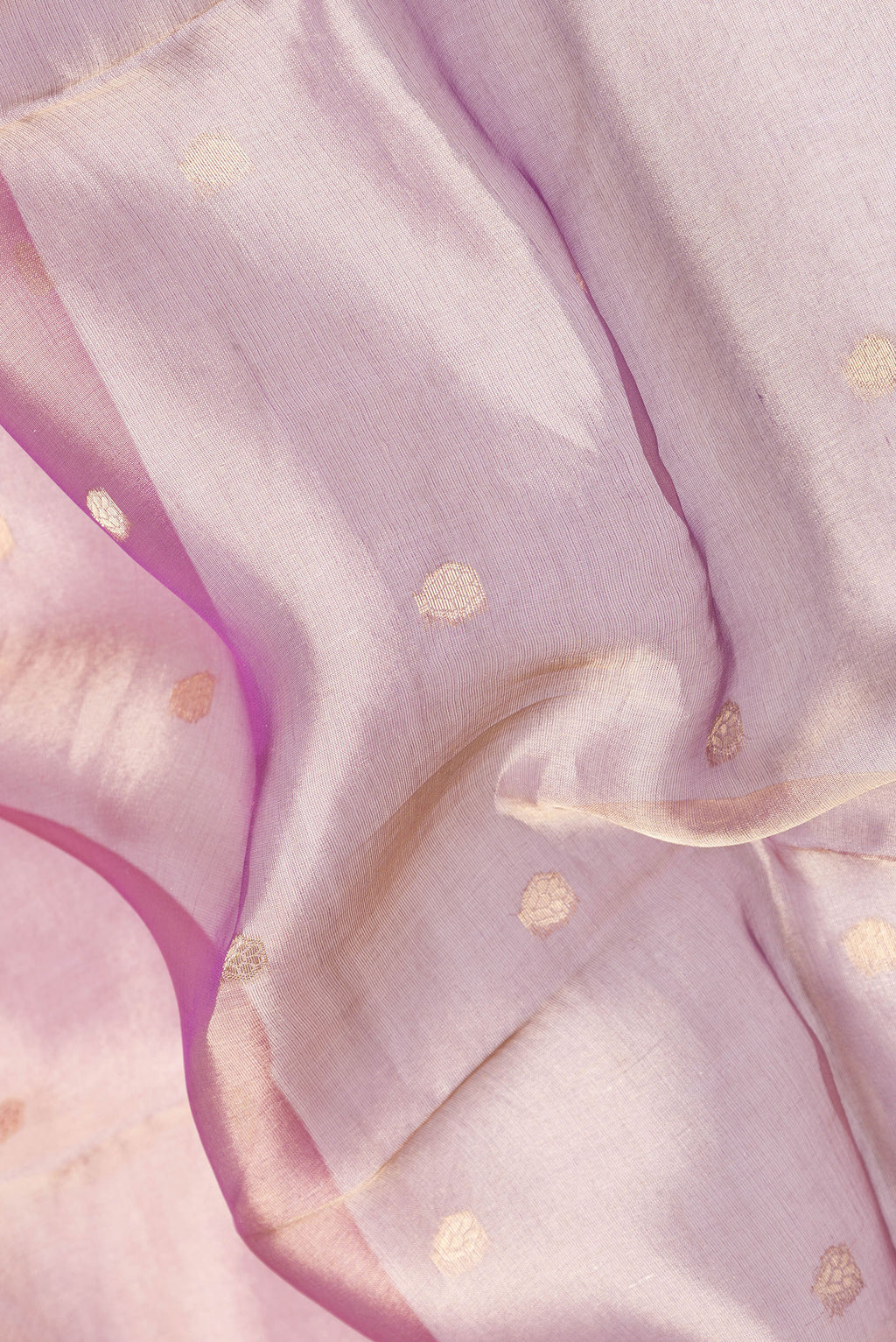 Close up of Pink Dual Tone Organza Silk Saree with Zari Butta on the body and Zari Border.  displaying folds