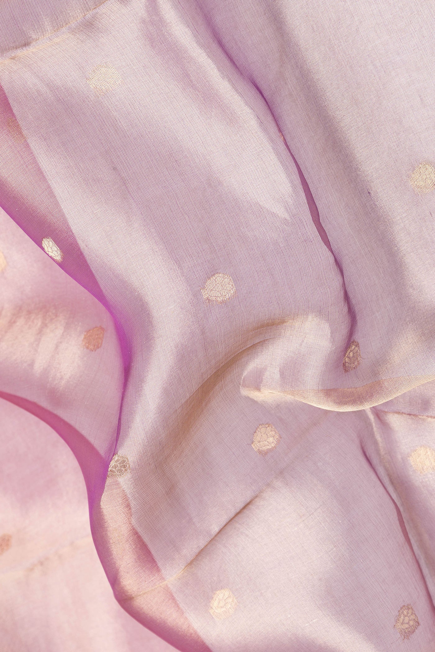 Close up of Pink Dual Tone Organza Silk Saree with Zari Butta on the body and Zari Border.  displaying folds