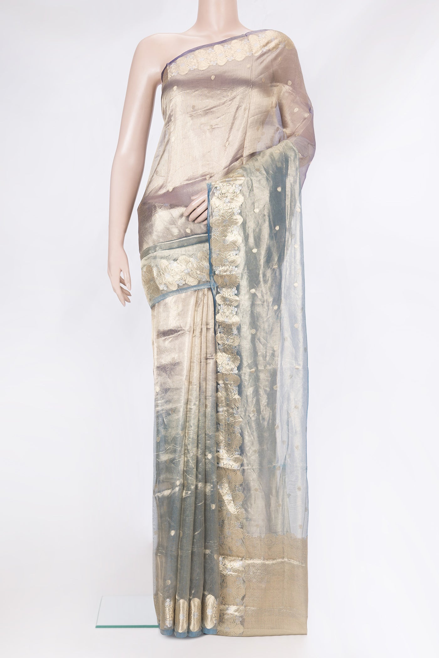 Green and Purple Color Organza Silk Saree with Zari Butta on the body and Zari Border.  displayed on a mannequin