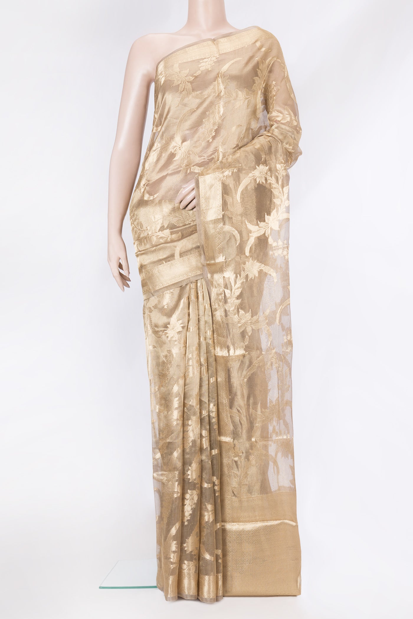 Gold Dual Tone Organza Silk Saree with Zari Brocade on the body and Zari Border.  displayed on a mannequin