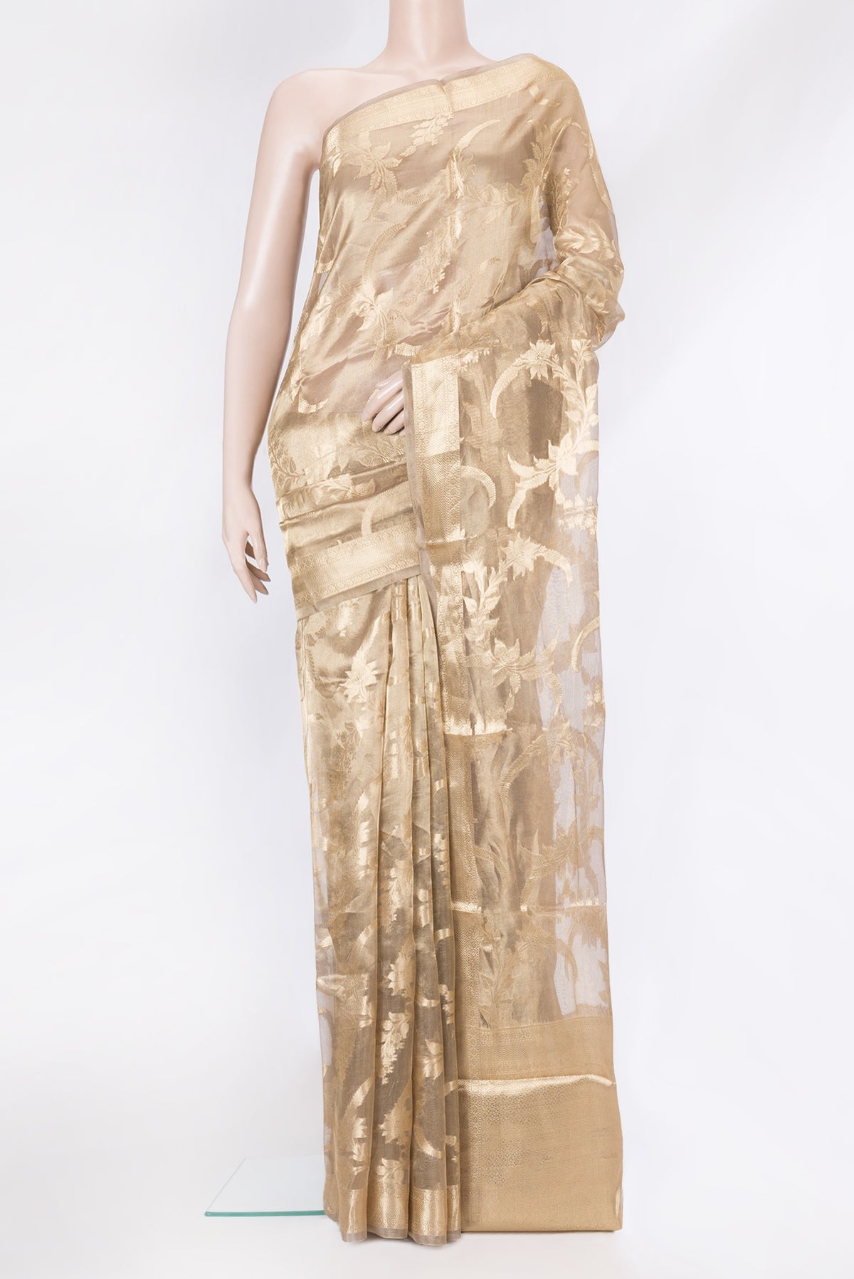 Gold Dual Tone Organza Silk Saree with Zari Brocade on the body and Zari Border.  displayed on a mannequin