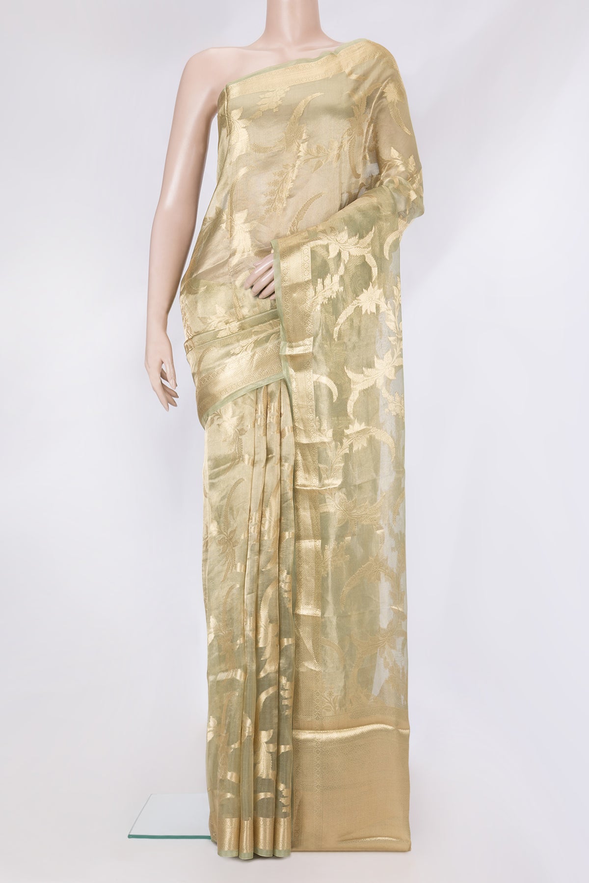 Pista Green Dual Tone Organza Silk Saree with Zari Brocade on the body and Zari Border.  displayed on a mannequin