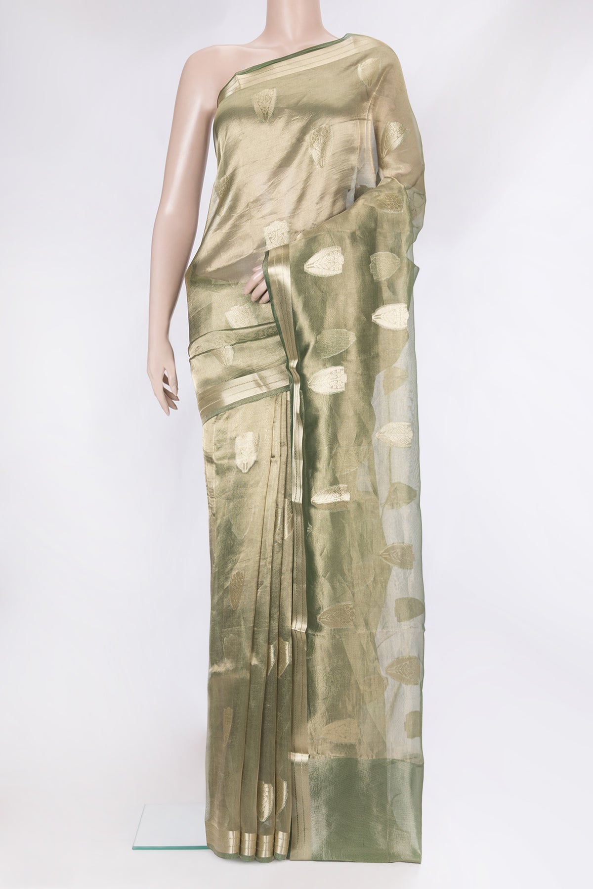 Green Dual Tone Organza Silk Saree with Zari Butta on the body and Zari Border.  displayed on a mannequin