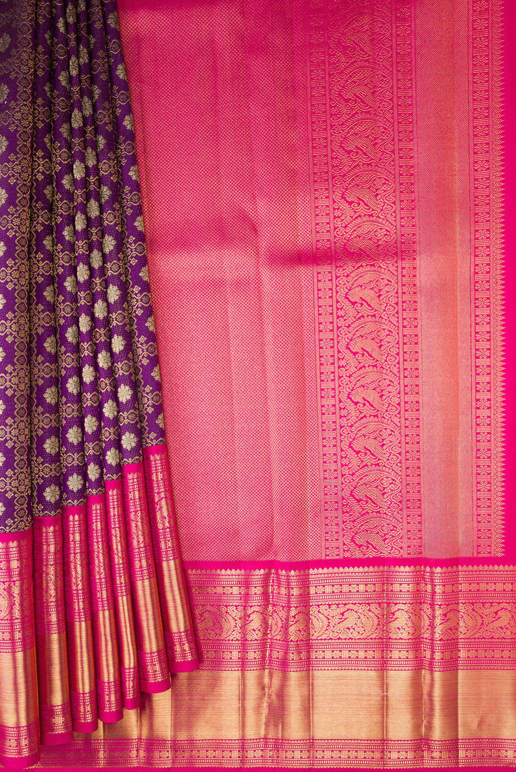 Pleats and pallu of Purple Kanchipuram Silk Saree with Zari Brocade on the body and Zari Border. 