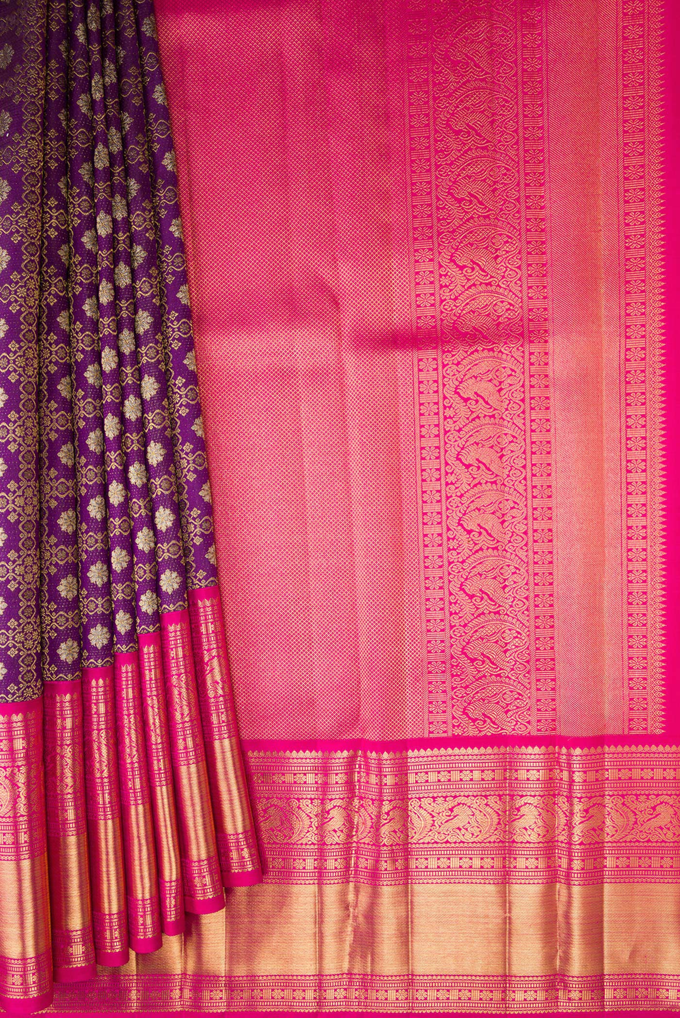 Pleats and pallu of Purple Kanchipuram Silk Saree with Zari Brocade on the body and Zari Border. 