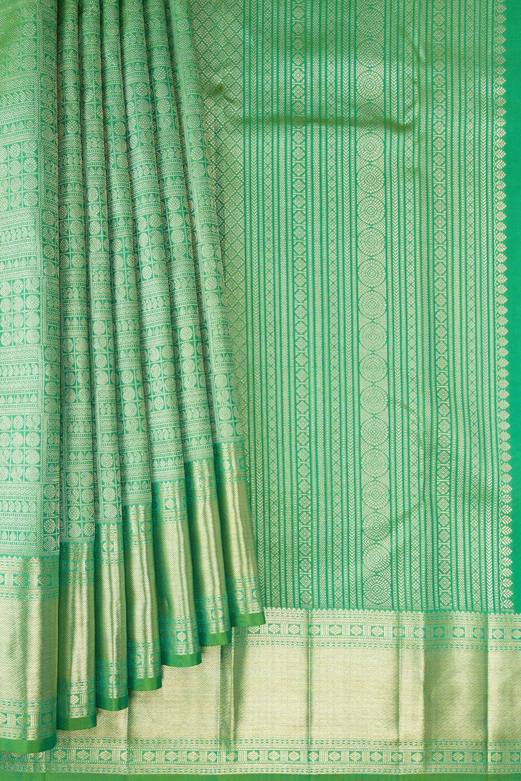 Pleats and pallu of Green Kanchipuram Silk Saree with Zari Brocade on the body and Zari Border. 