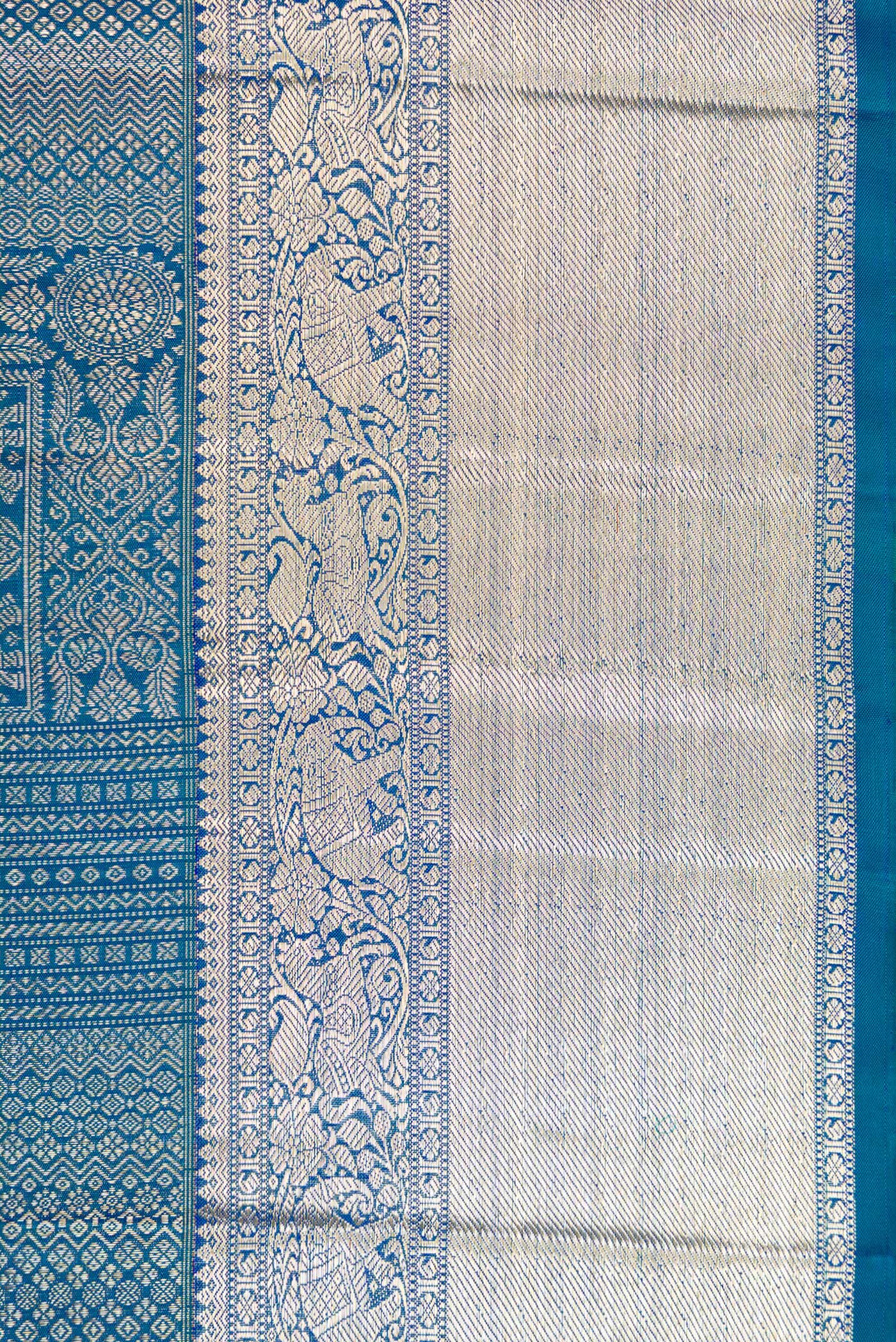 Border image of Peacock Blue Dual Tone Kanchipuram Silk Saree with Zari Brocade on the body and Zari Border. 