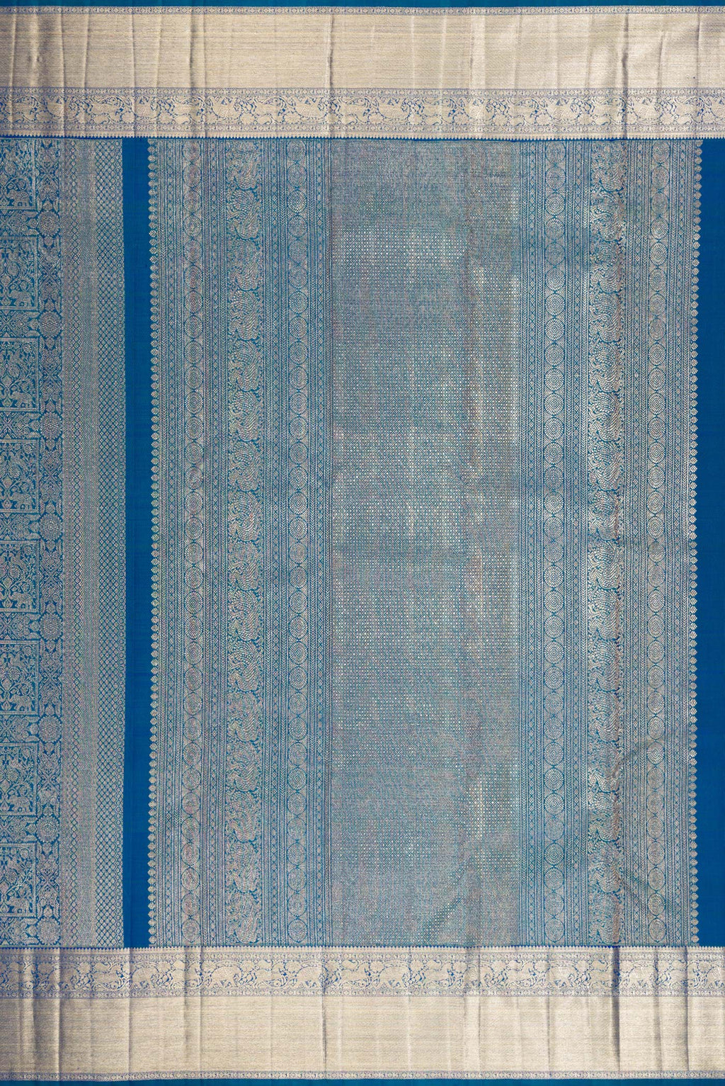 Close up image of the pallu of Peacock Blue Dual Tone Kanchipuram Silk Saree with Zari Brocade on the body and Zari Border. 