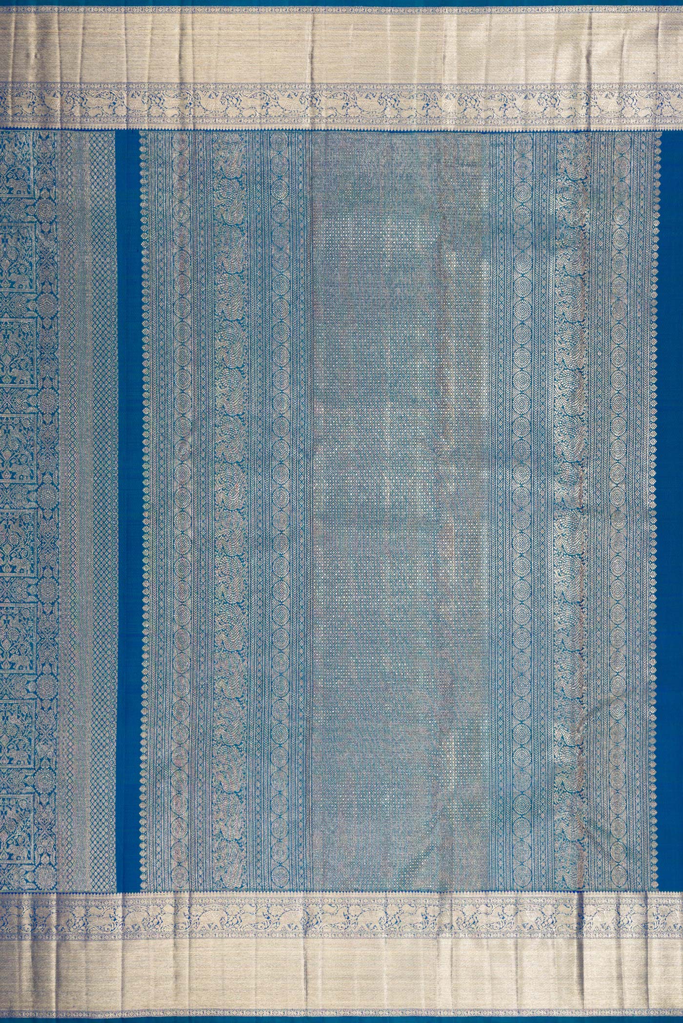 Close up image of the pallu of Peacock Blue Dual Tone Kanchipuram Silk Saree with Zari Brocade on the body and Zari Border. 