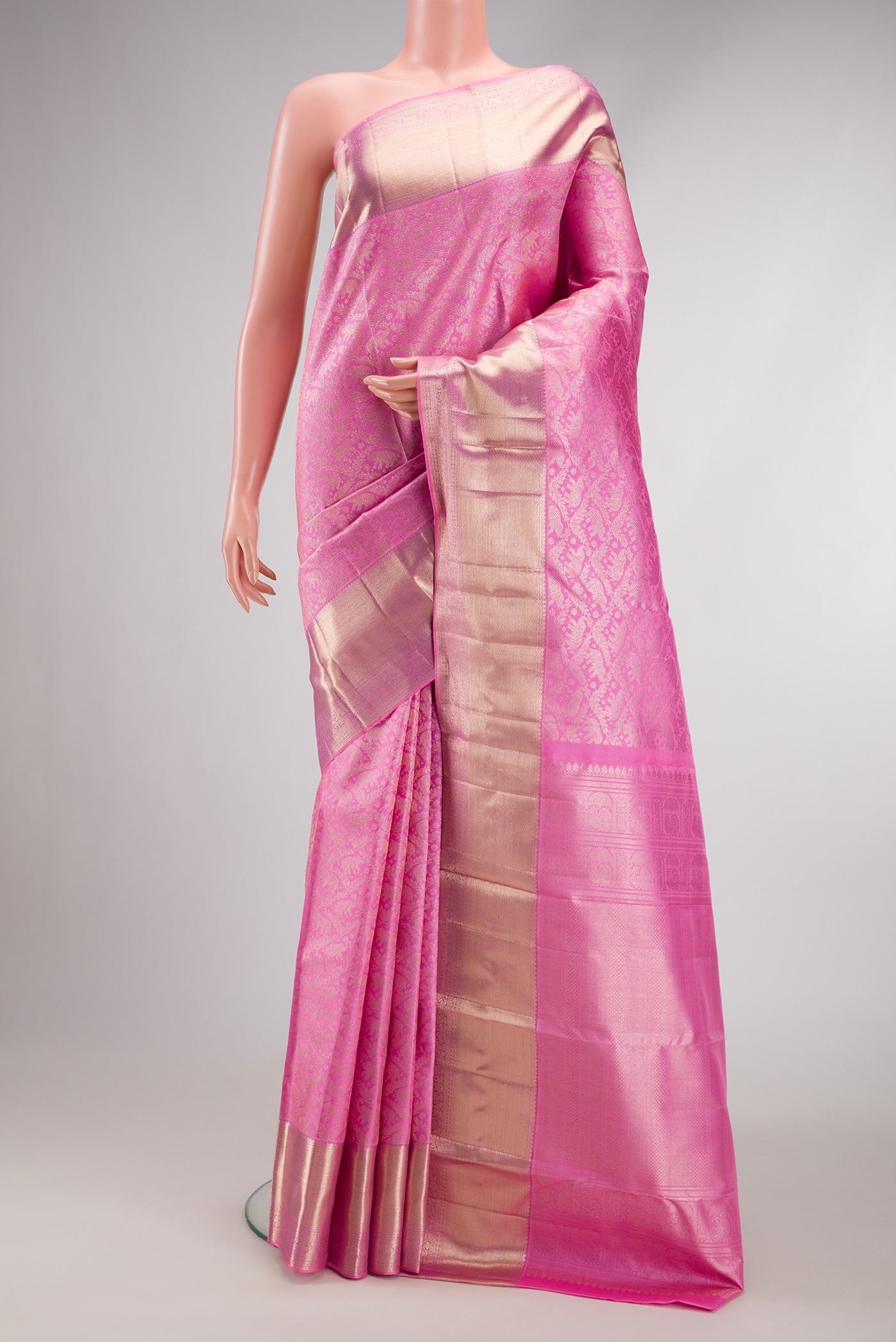 Pink Dual Tone Kanchipuram Silk Saree with Zari Brocade on the body and Zari Border.  displayed on a mannequin