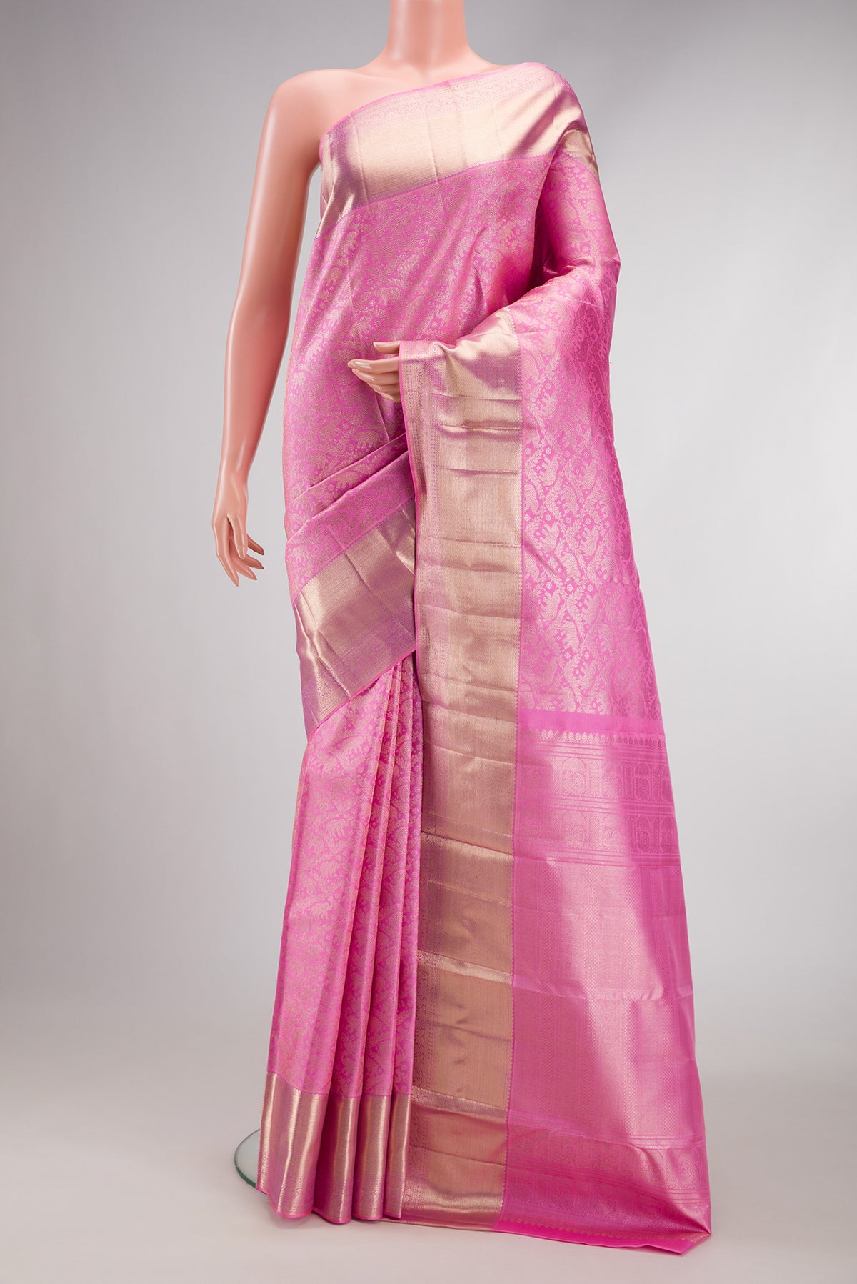 Pink Dual Tone Kanchipuram Silk Saree with Zari Brocade on the body and Zari Border.  displayed on a mannequin