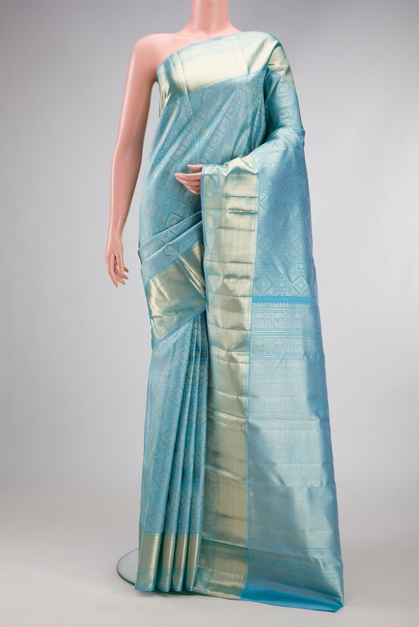 Sky Blue Kanchipuram Silk Saree with Zari Brocade on the body and Zari Border.  displayed on a mannequin