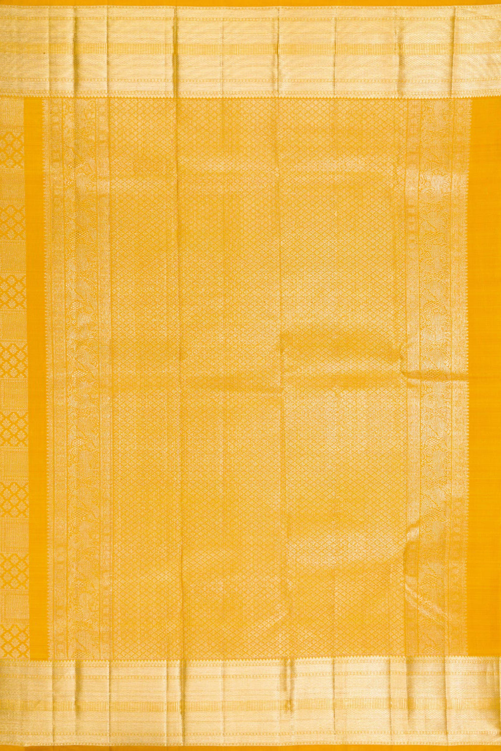 Close up image of the pallu of Mustard Kanchipuram Silk Saree with Zari Brocade on the body and Zari Border. 