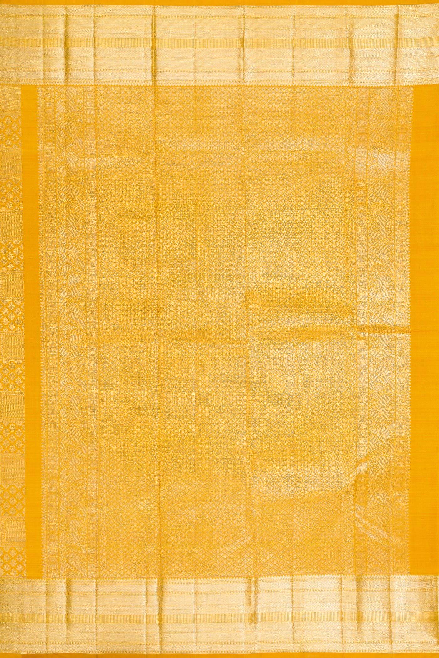 Close up image of the pallu of Mustard Kanchipuram Silk Saree with Zari Brocade on the body and Zari Border. 