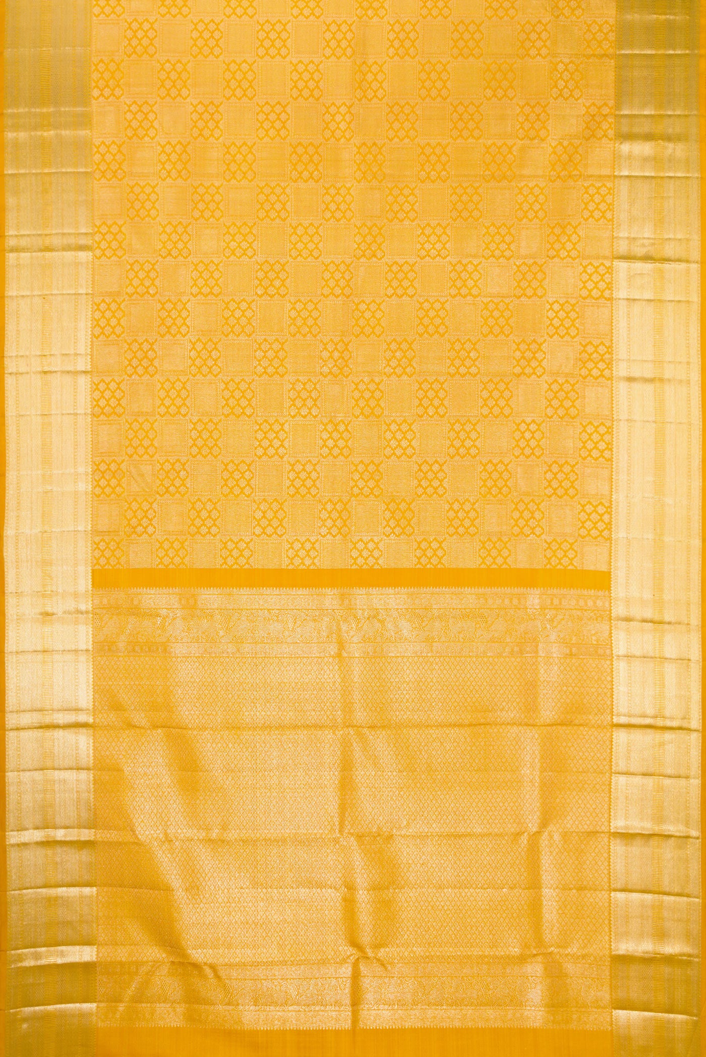 Flat view of Mustard Kanchipuram Silk Saree with Zari Brocade on the body and Zari Border. 