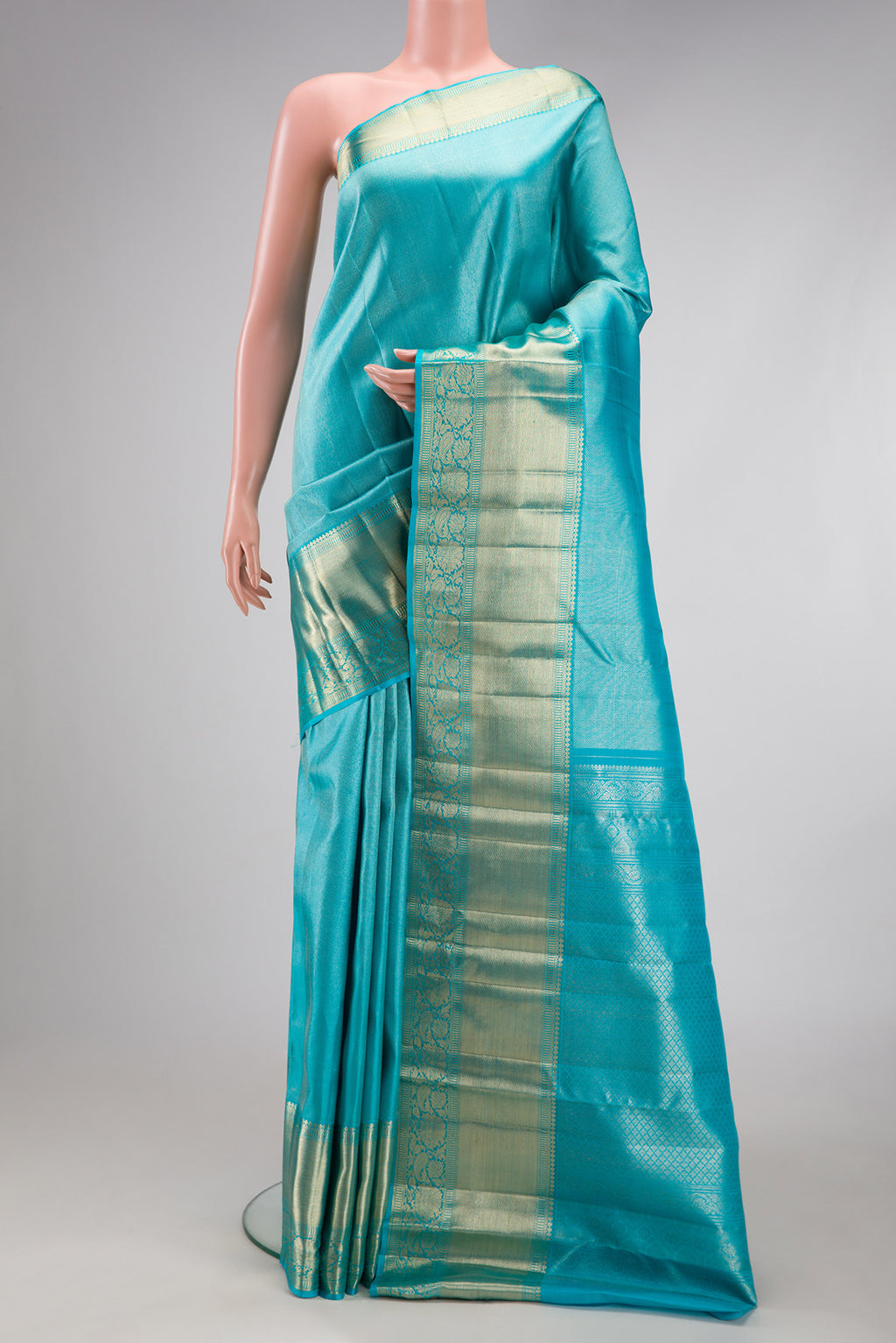 Sky Blue Kanchipuram Silk Saree with Zari Brocade on the body and Zari Border.  displayed on a mannequin