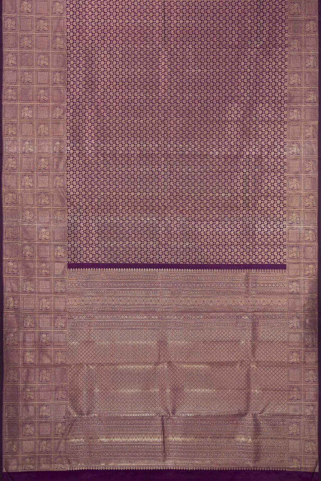Flat view of Purple Kanchipuram Silk Saree with Zari Brocade on the body and Fancy Border. 