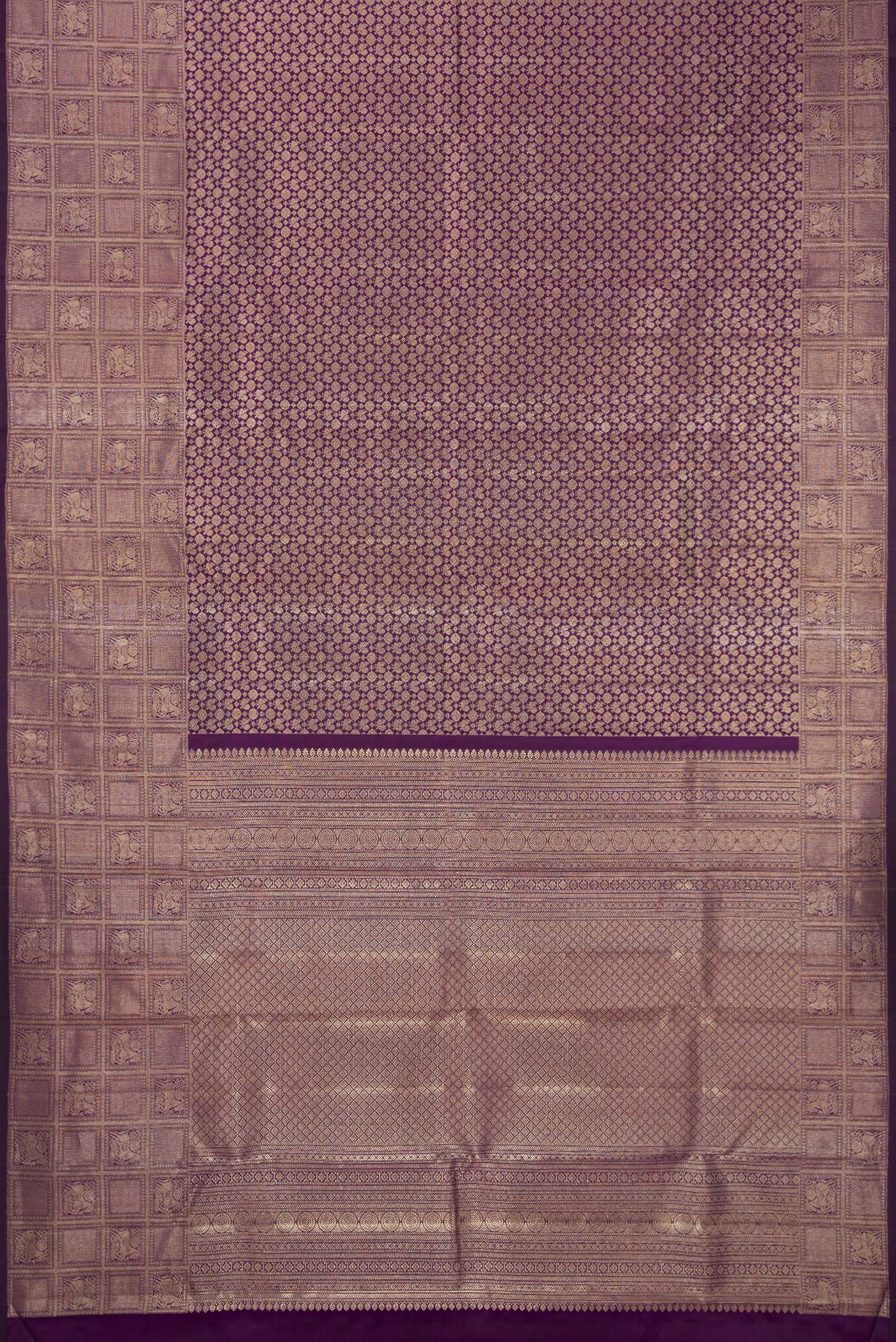 Flat view of Purple Kanchipuram Silk Saree with Zari Brocade on the body and Fancy Border. 