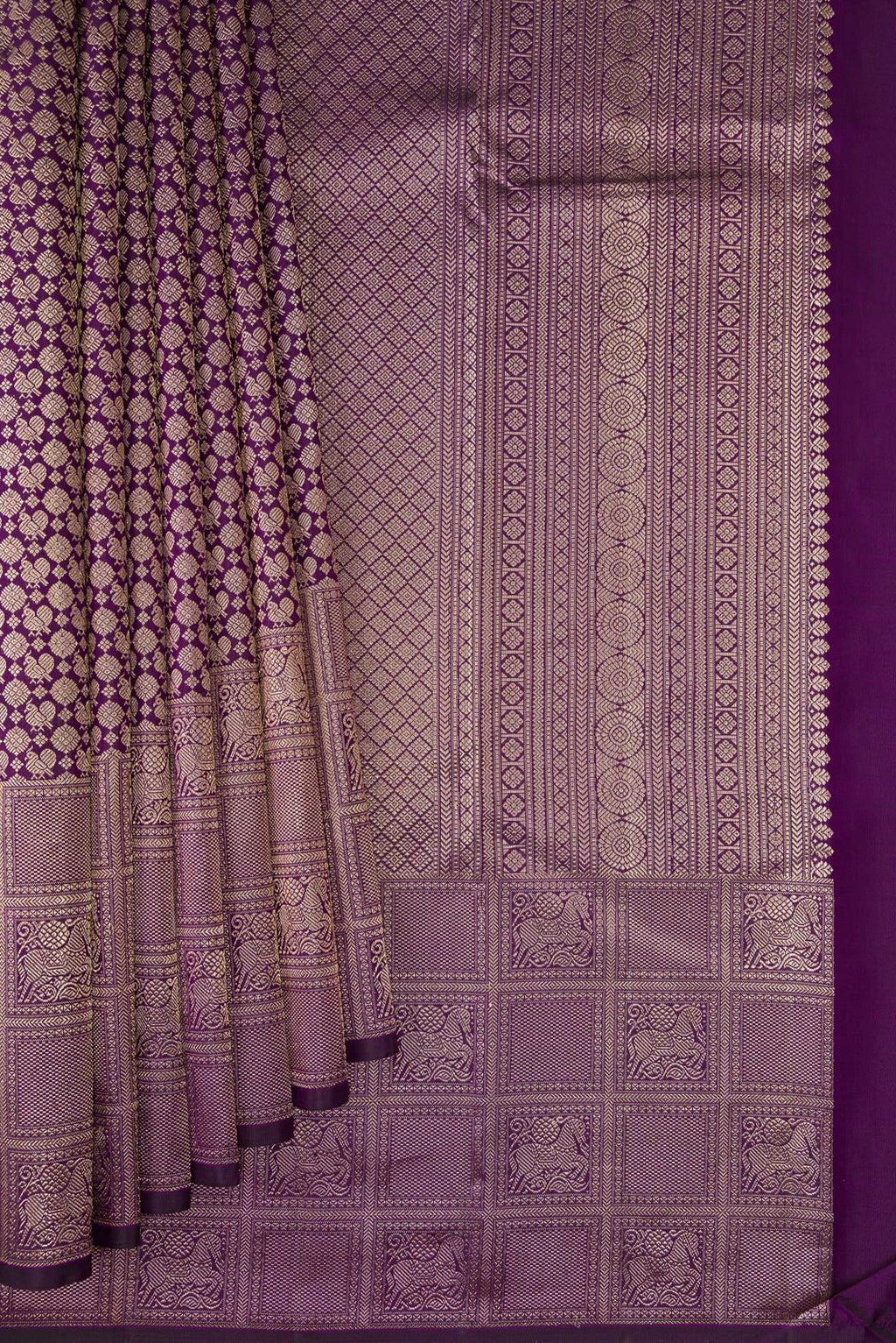 Pleats and pallu of Purple Kanchipuram Silk Saree with Zari Brocade on the body and Fancy Border. 