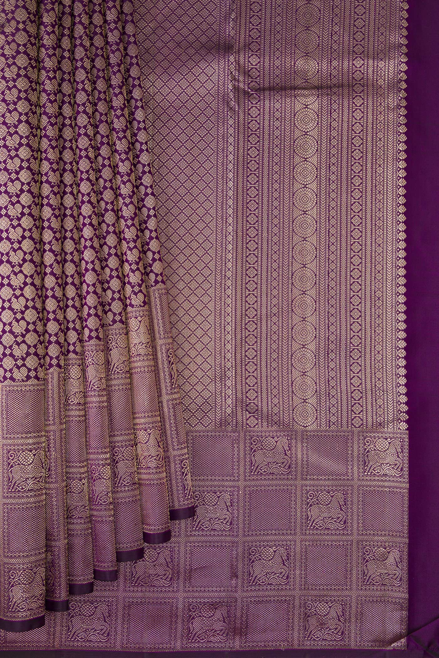 Pleats and pallu of Purple Kanchipuram Silk Saree with Zari Brocade on the body and Fancy Border. 