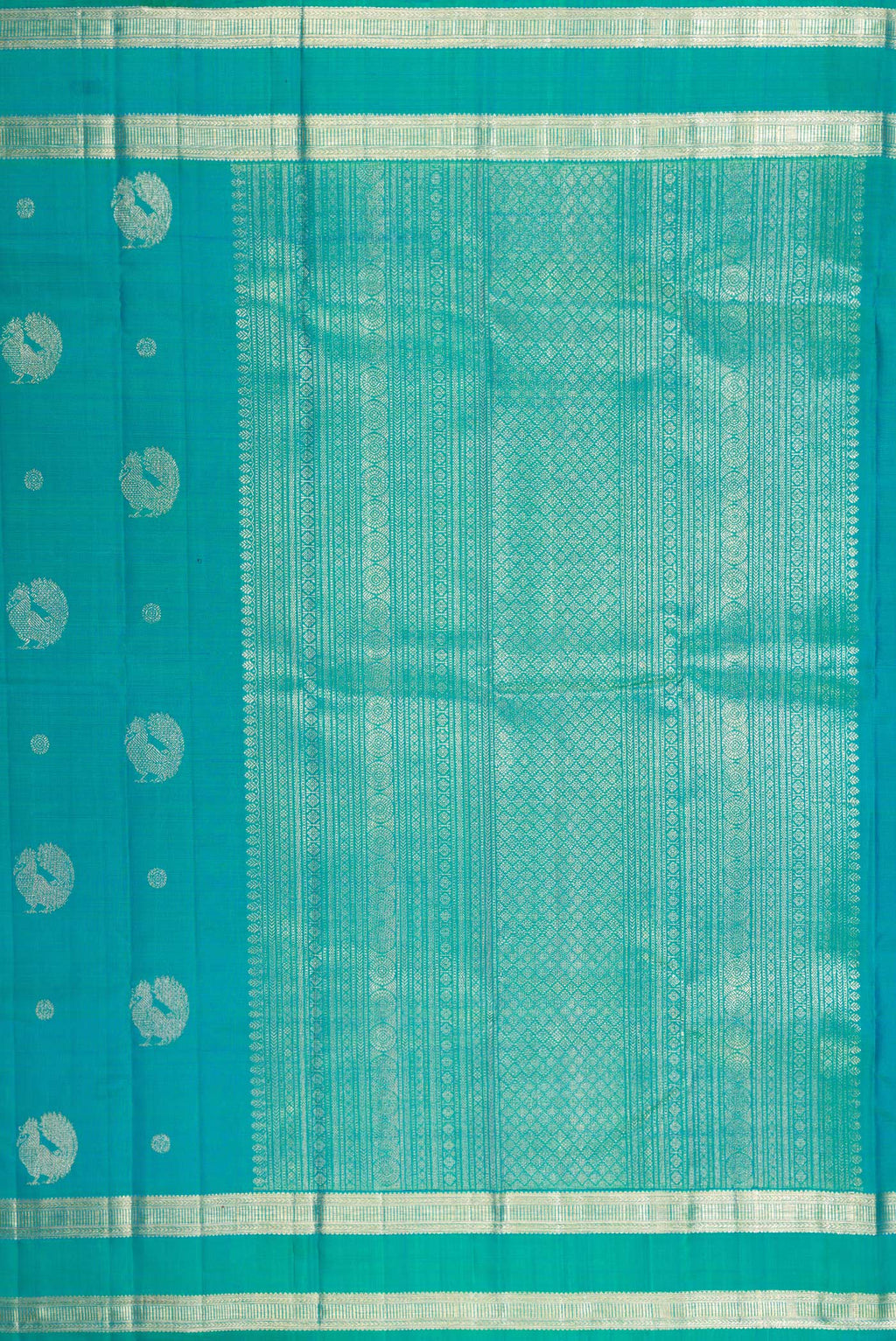 Close up image of the pallu of Peacock Blue Dual Tone Kanjivaram Silk Saree with Zari Butta on the body and Zari Border. 