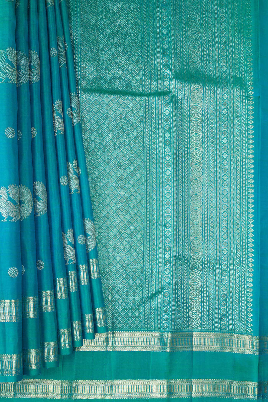 Pleats and pallu of Peacock Blue Dual Tone Kanjivaram Silk Saree with Zari Butta on the body and Zari Border. 