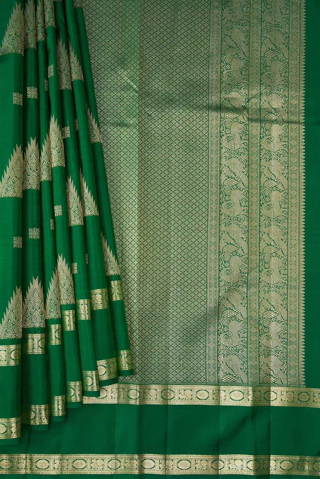 Pleats and pallu of Bottle Green Kanjivaram Silk Saree with Zari Butta on the body and Zari Border. 
