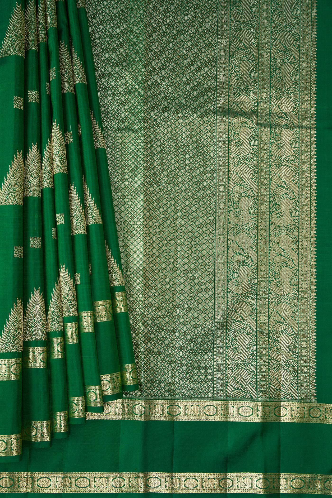 Pleats and pallu of Bottle Green Kanjivaram Silk Saree with Zari Butta on the body and Zari Border. 