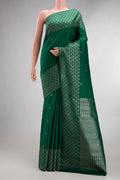 Pure Silk Bottle Green Kanjivaram Saree with Zari Butta on the body and Fancy Border.  displayed on a mannequin