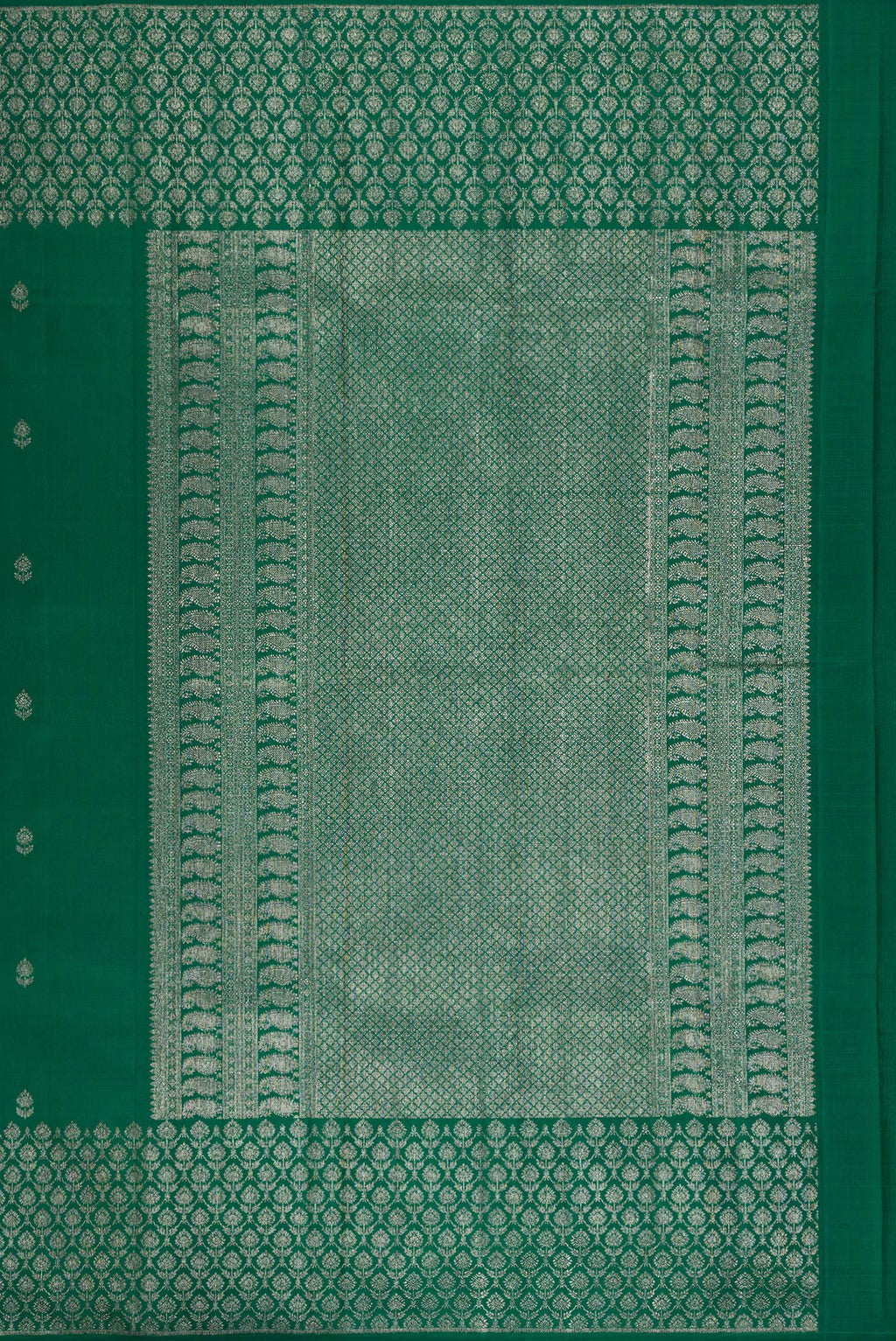 Close up image of the pallu of Pure Silk Bottle Green Kanjivaram Saree with Zari Butta on the body and Fancy Border. 