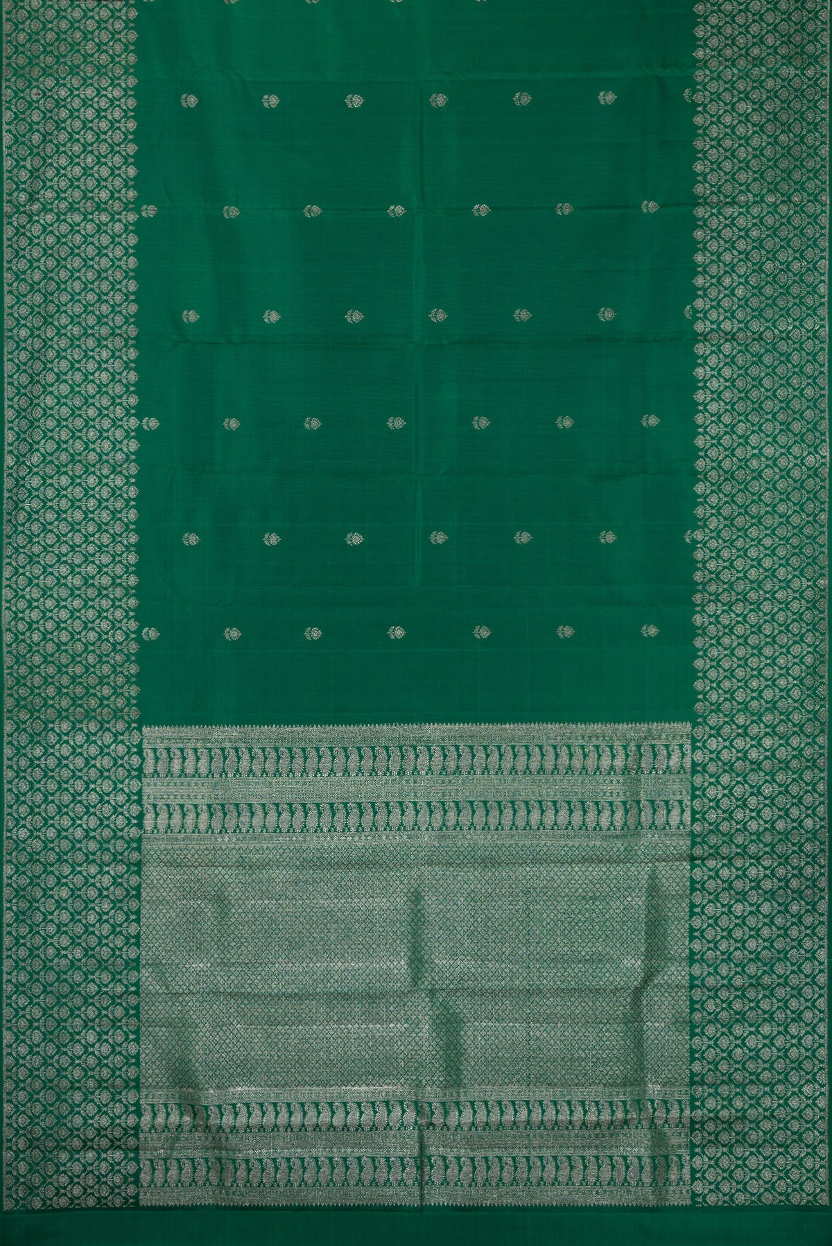 Flat view of Pure Silk Bottle Green Kanjivaram Saree with Zari Butta on the body and Fancy Border. 