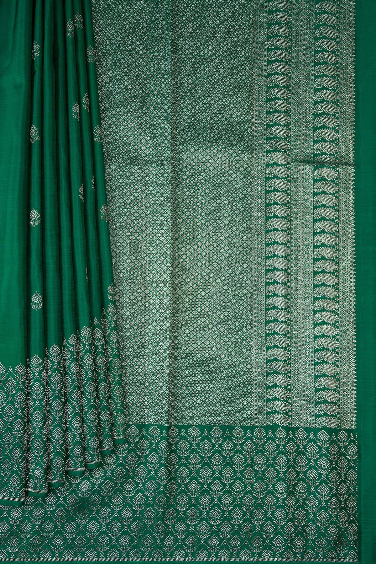 Pleats and pallu of Pure Silk Bottle Green Kanjivaram Saree with Zari Butta on the body and Fancy Border. 