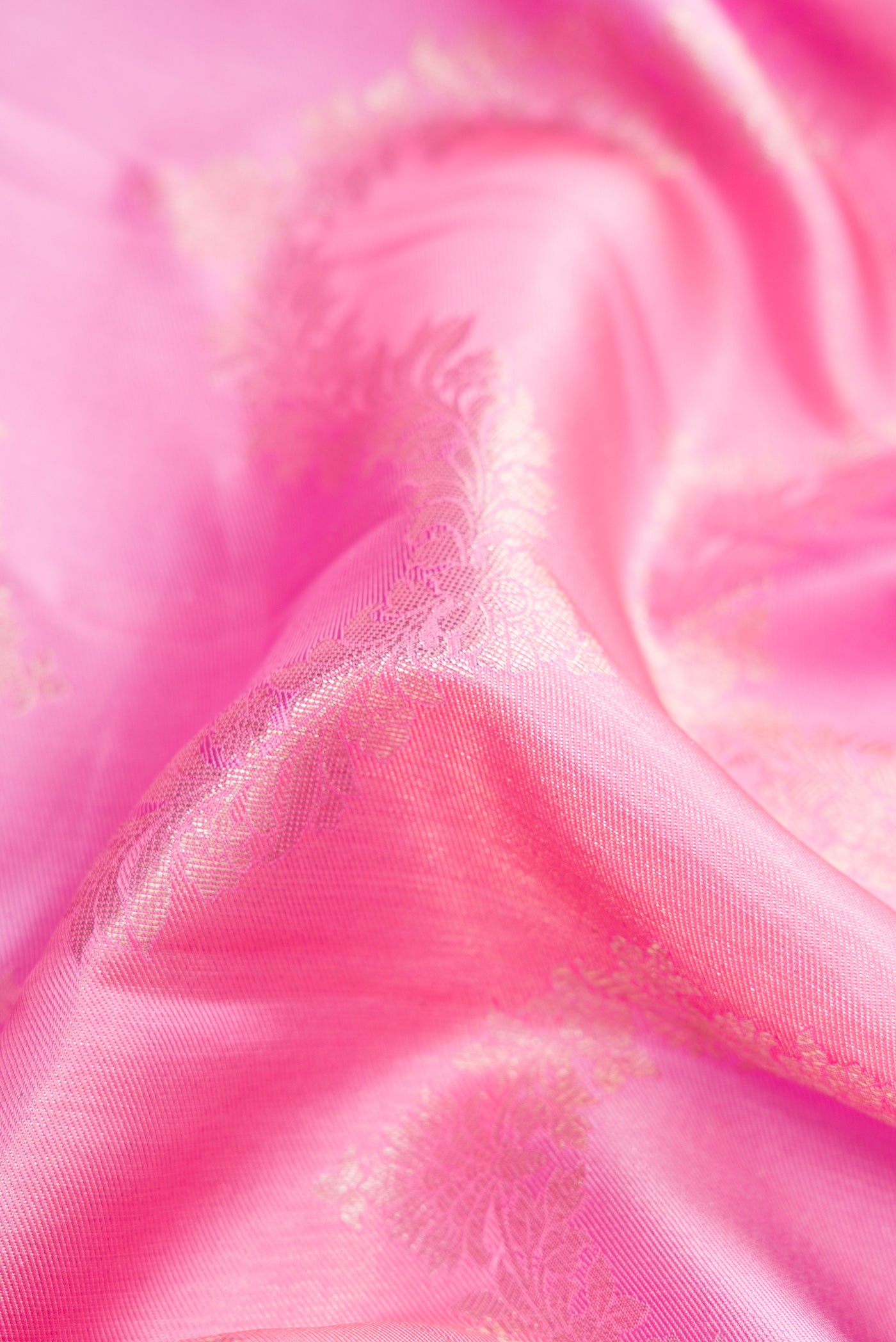 Close up of Pink Dual Tone Kanjivaram Silk Saree with Zari Brocade on the body and Zari Border.  displaying folds