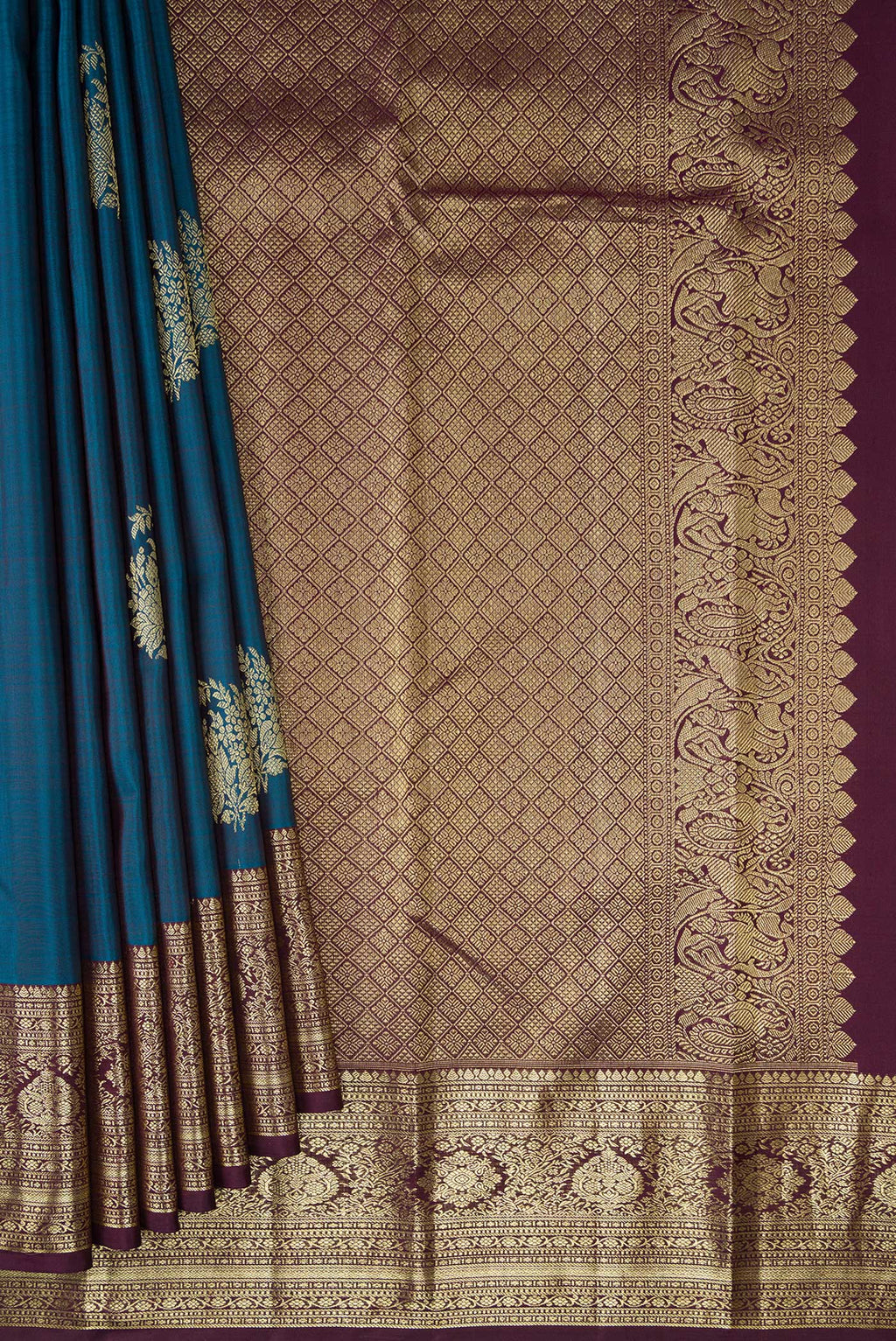 Pleats and pallu of Peacock Blue Kanjivaram Silk Saree with Zari Butta on the body and Zari Border. 