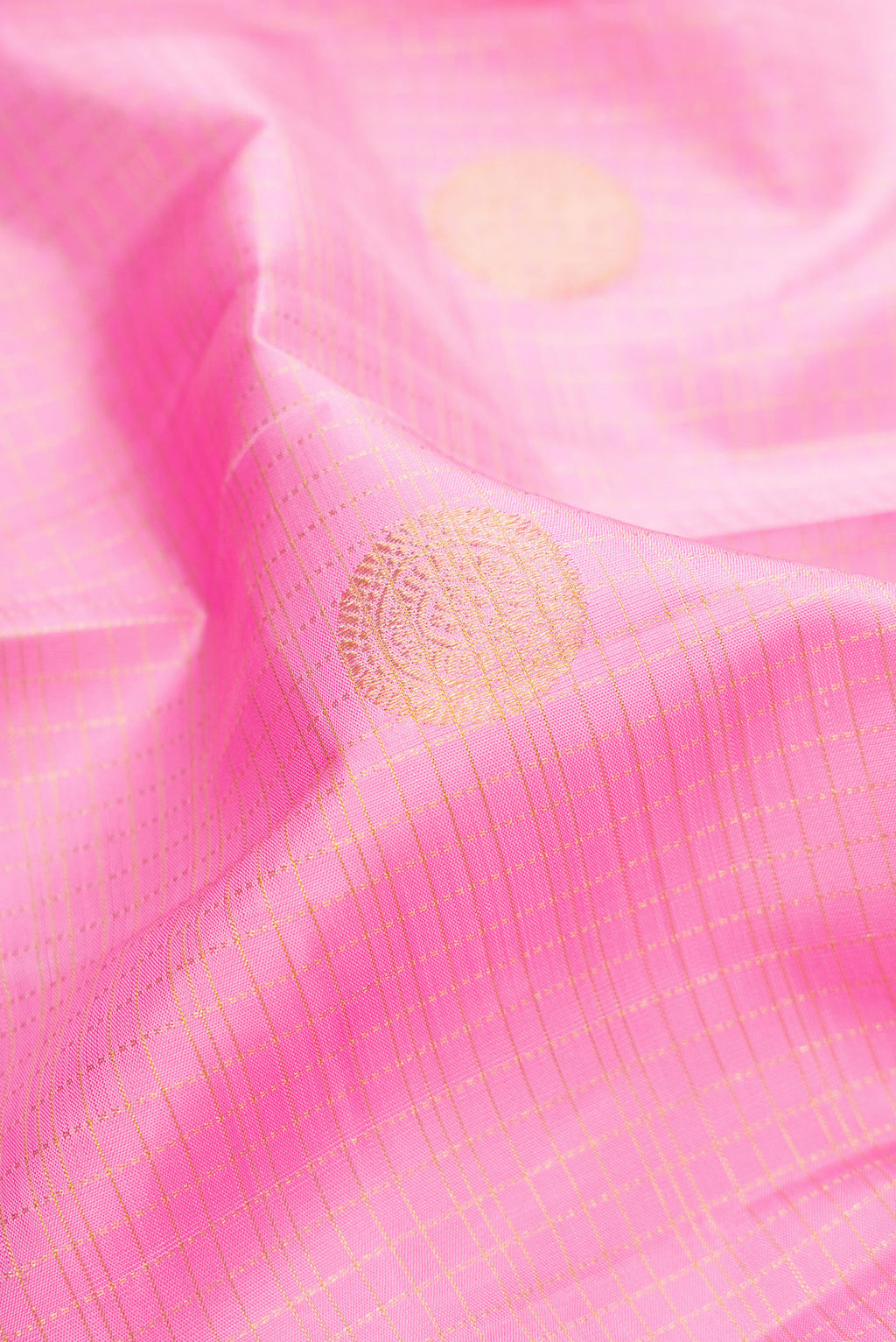 Close up of Pink Dual Tone Kanjivaram Silk Saree with Checked design on the body and Zari Border.  displaying folds