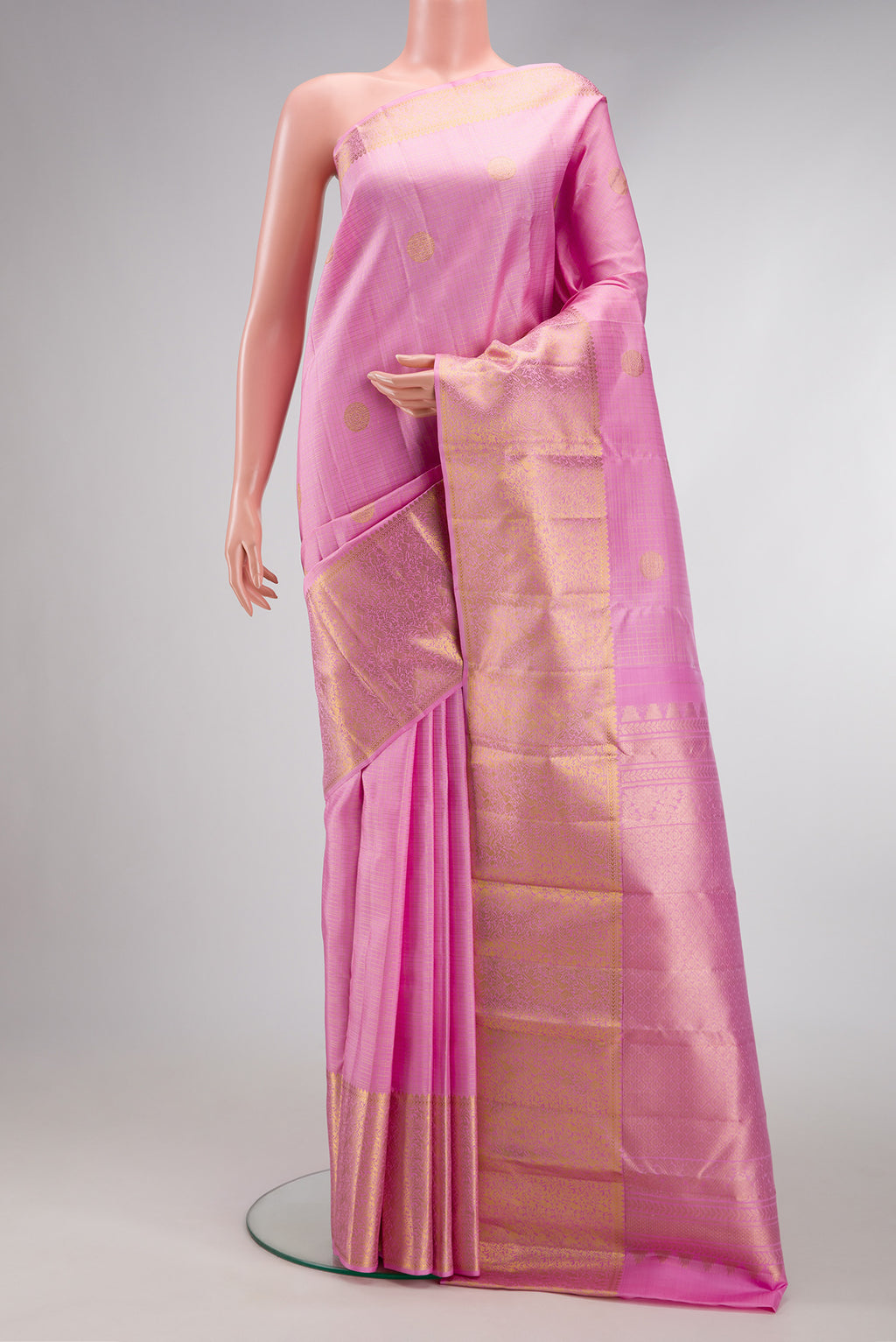 Pink Dual Tone Kanjivaram Silk Saree with Checked design on the body and Zari Border.  displayed on a mannequin