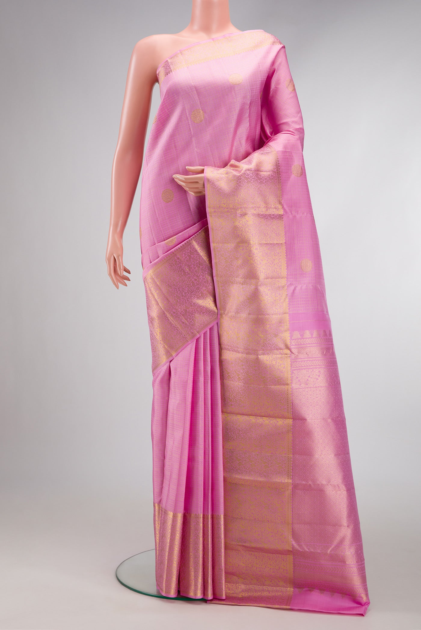 Pink Dual Tone Kanjivaram Silk Saree with Checked design on the body and Zari Border.  displayed on a mannequin