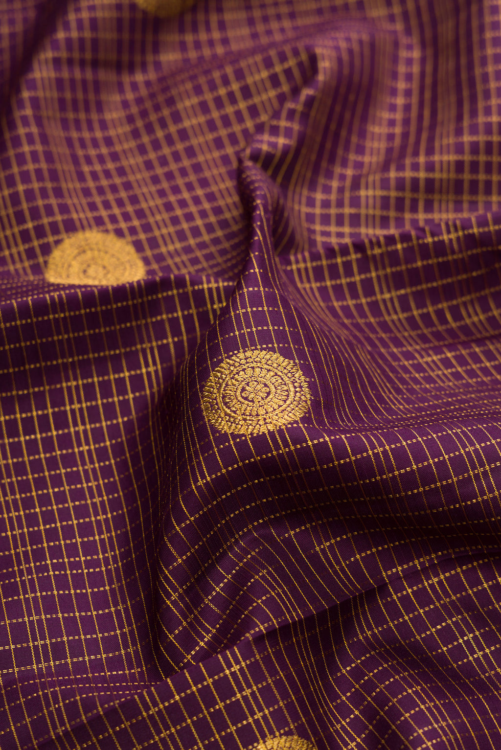 Close up of Burgundy Dual Tone Kanjivaram Silk Saree with Stripes on the body and Zari Border.  displaying folds