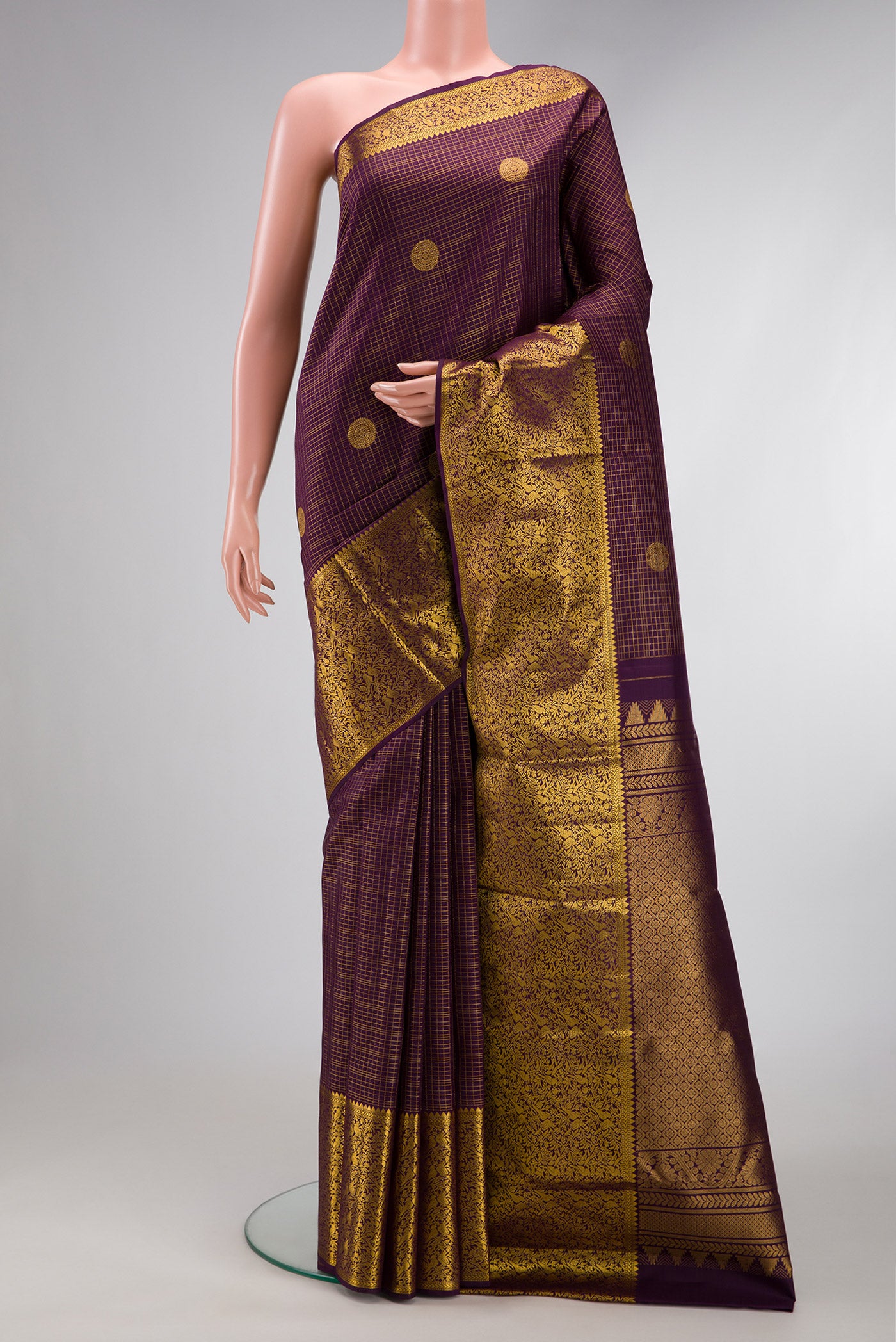 Burgundy Dual Tone Kanjivaram Silk Saree with Stripes on the body and Zari Border.  displayed on a mannequin