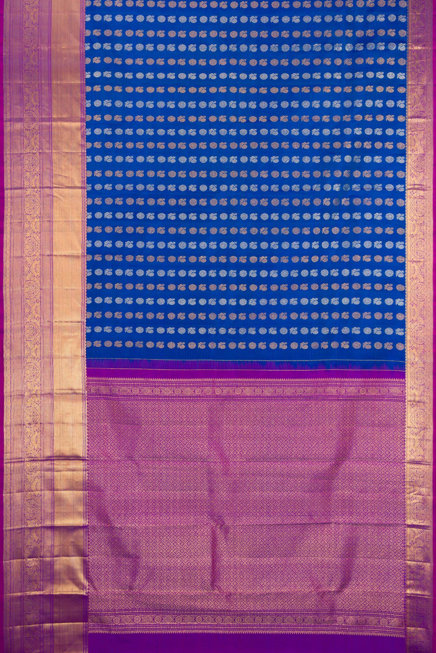 Flat view of Royal Blue Kanjivaram Silk Saree with Zari Butta on the body and Zari Border. 