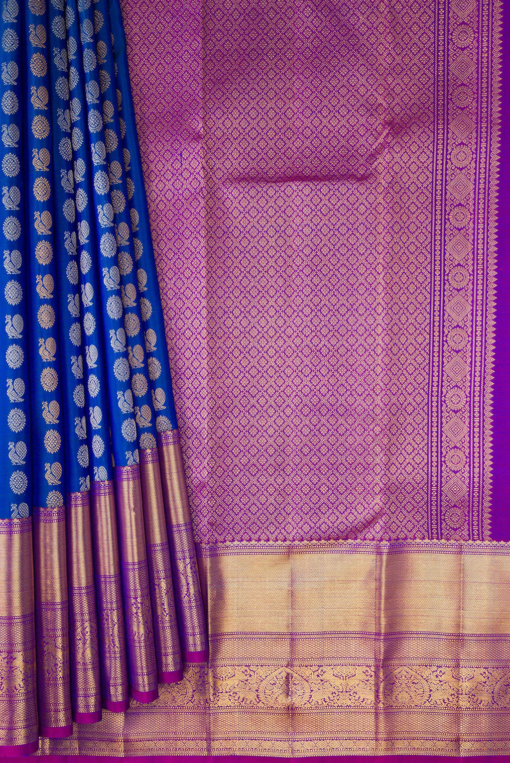 Pleats and pallu of Royal Blue Kanjivaram Silk Saree with Zari Butta on the body and Zari Border. 