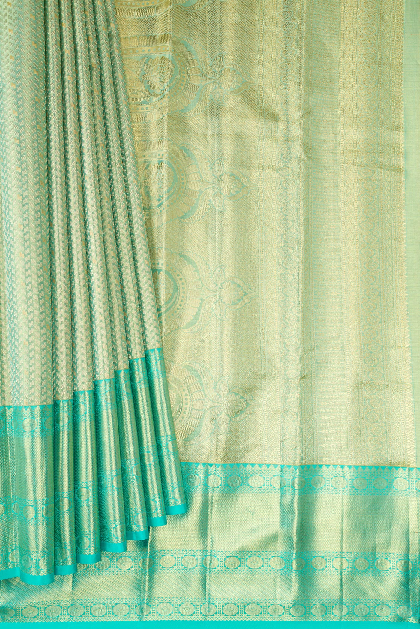 Pleats and pallu of Light Green Dual Tone Kanchipuram Tissue Silk Saree with Zari Brocade on the body and Zari Border. 