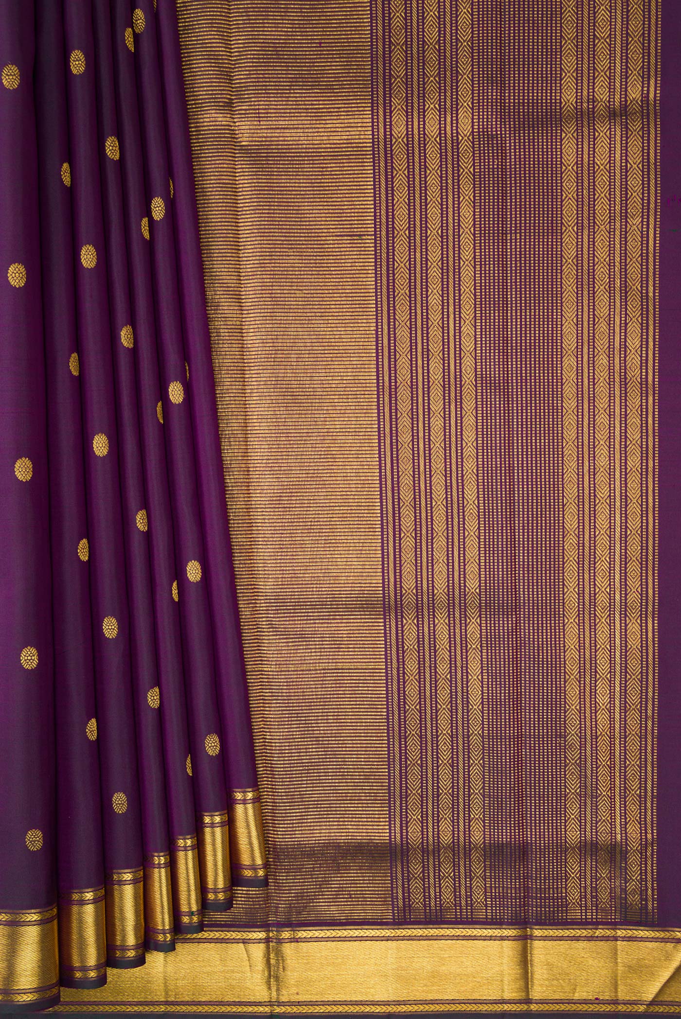 Pleats and pallu of Purple Kanjivaram Silk Saree with Zari Butta on the body and Zari Border. 